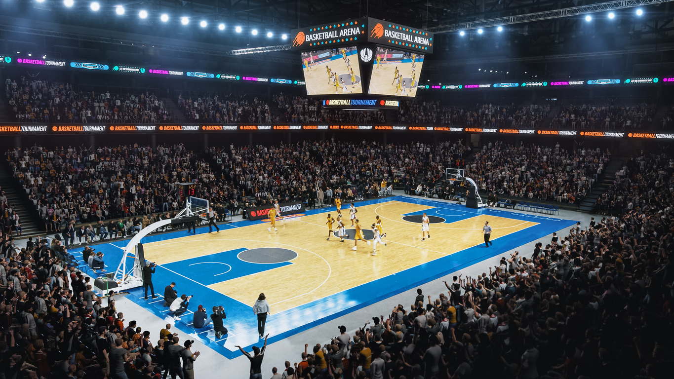 a sold out arena with spectators watching basketball tournament