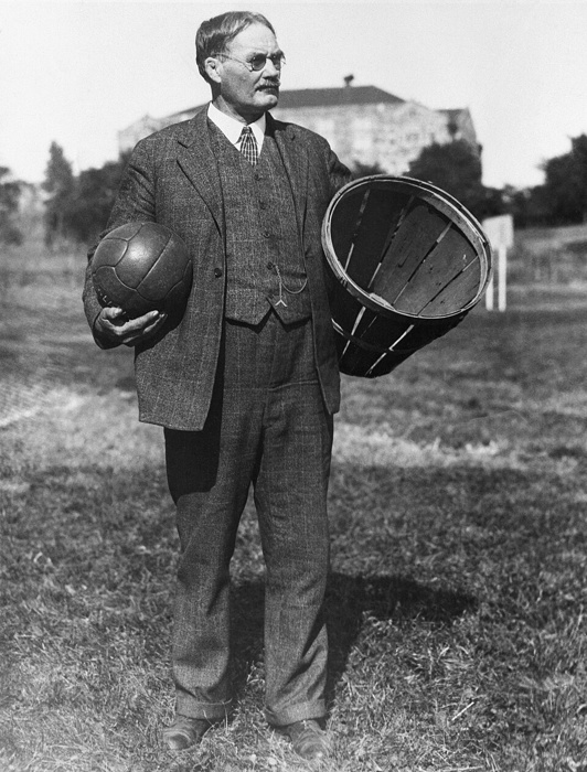 James Naismith with a soccer ball and a basket