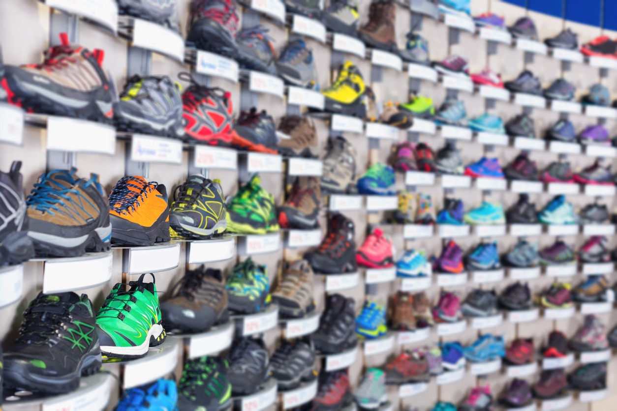 A shelf full of basketball shoes
