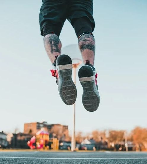 A man jumping on during a basketball game