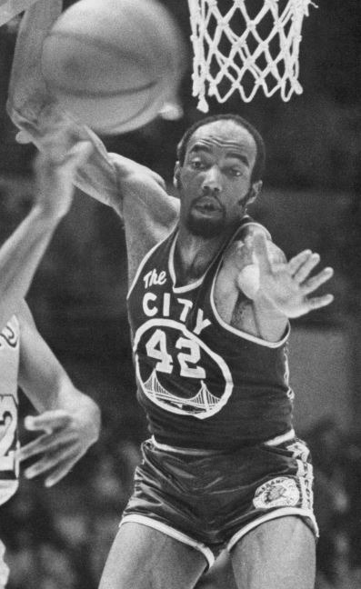 Nate Thurmond wearing a Warriors jersey
