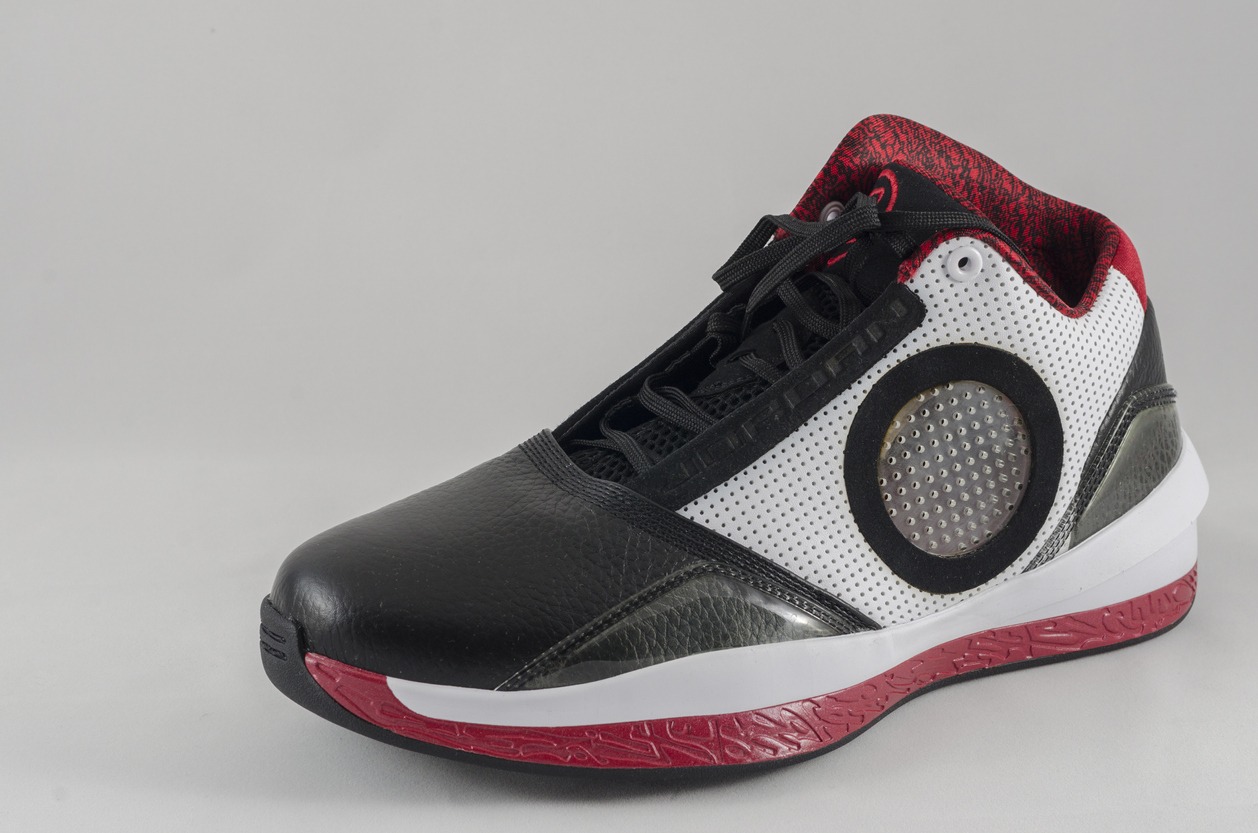 a basketball shoe with an upper made of different materials