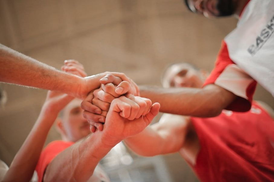 basketball-team-stacking-hands-together