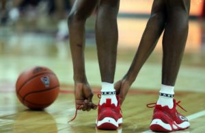 lacing up basketball shoes