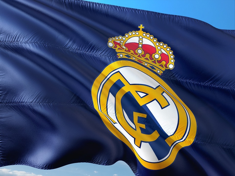 Real Madrid logo and flag