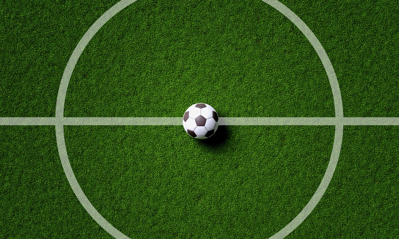 soccer ball at the center of the field