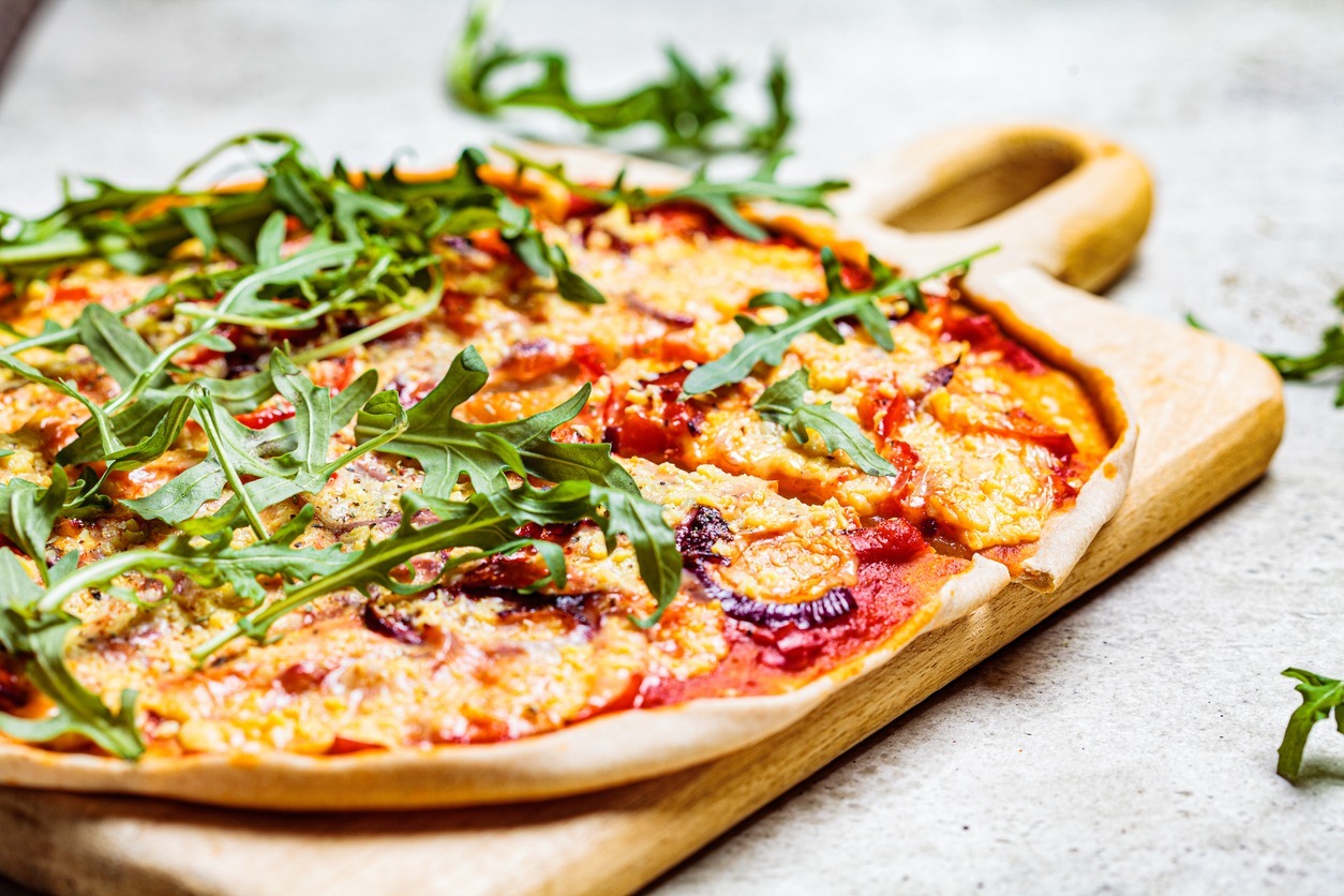A-vegan-pizza-with-tomato-sauce-pepper-vegan-cheese-and-arugula